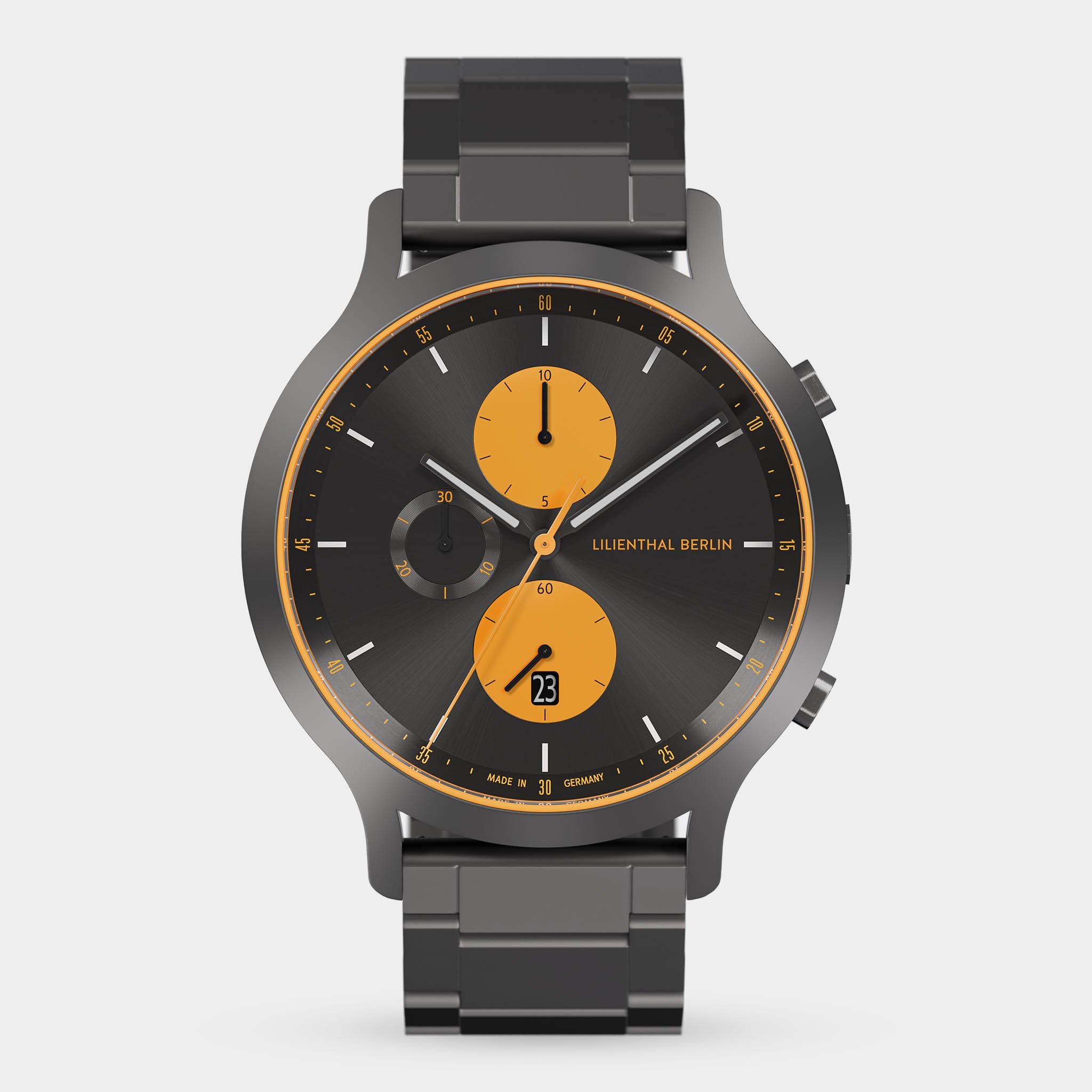 Modern chronograph watch with black metal band, black dial, and orange subdials.
