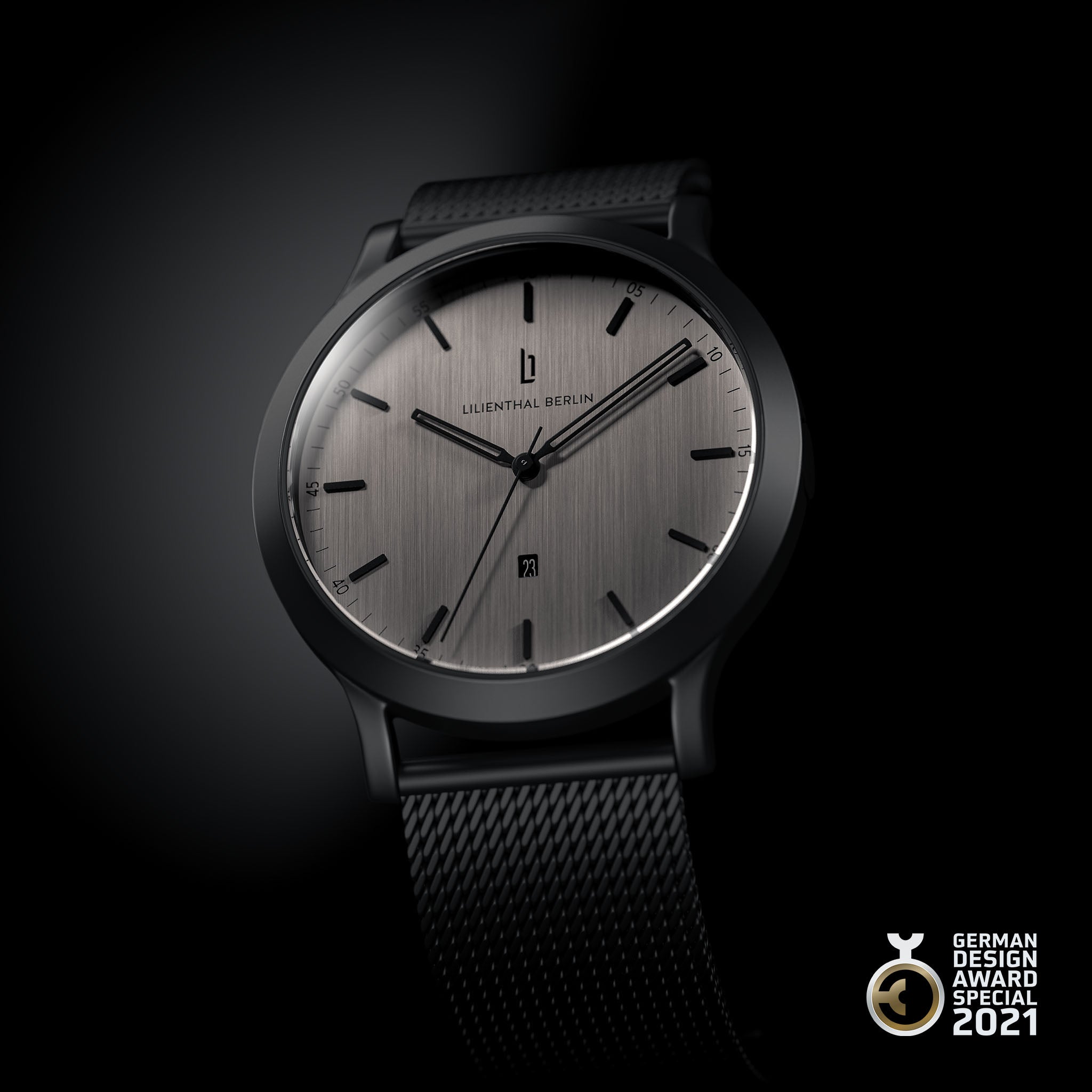 Minimalist silver and black wristwatch with mesh strap, date display, German Design Award 2021 badge