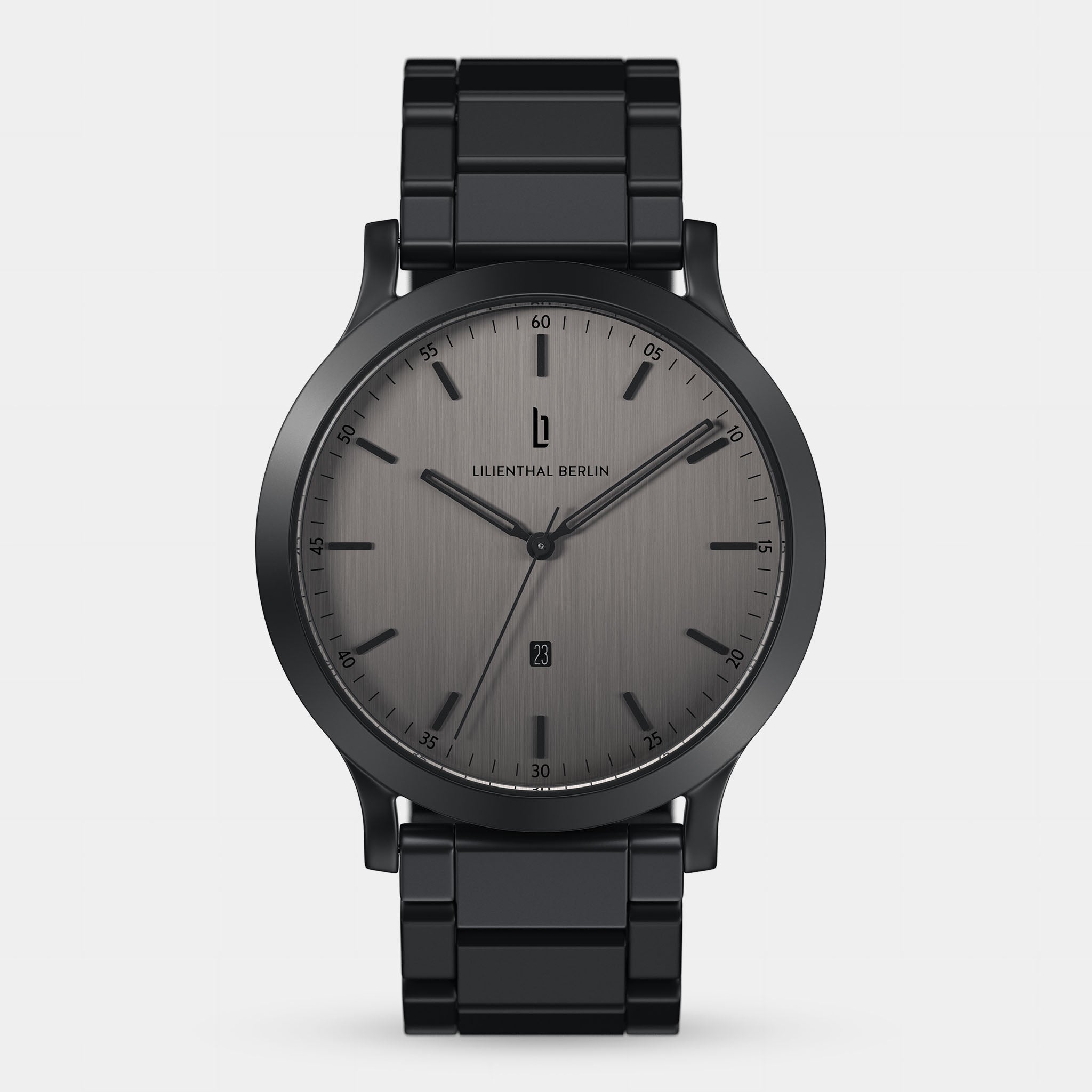 Minimalist black metal wristwatch with grey brushed dial and date display on white background