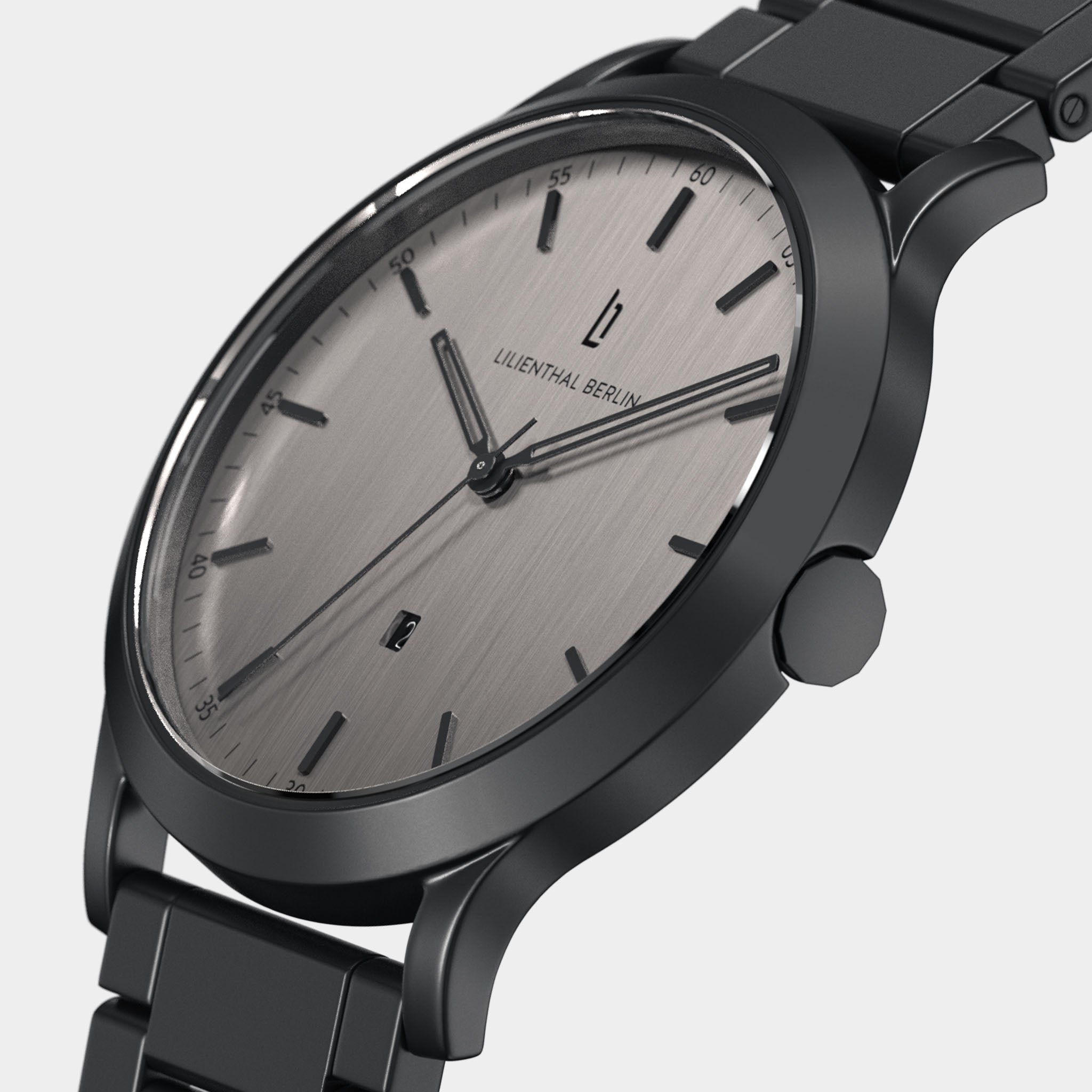 Minimalist stainless steel wristwatch with silver dial, black markers, and metal bracelet