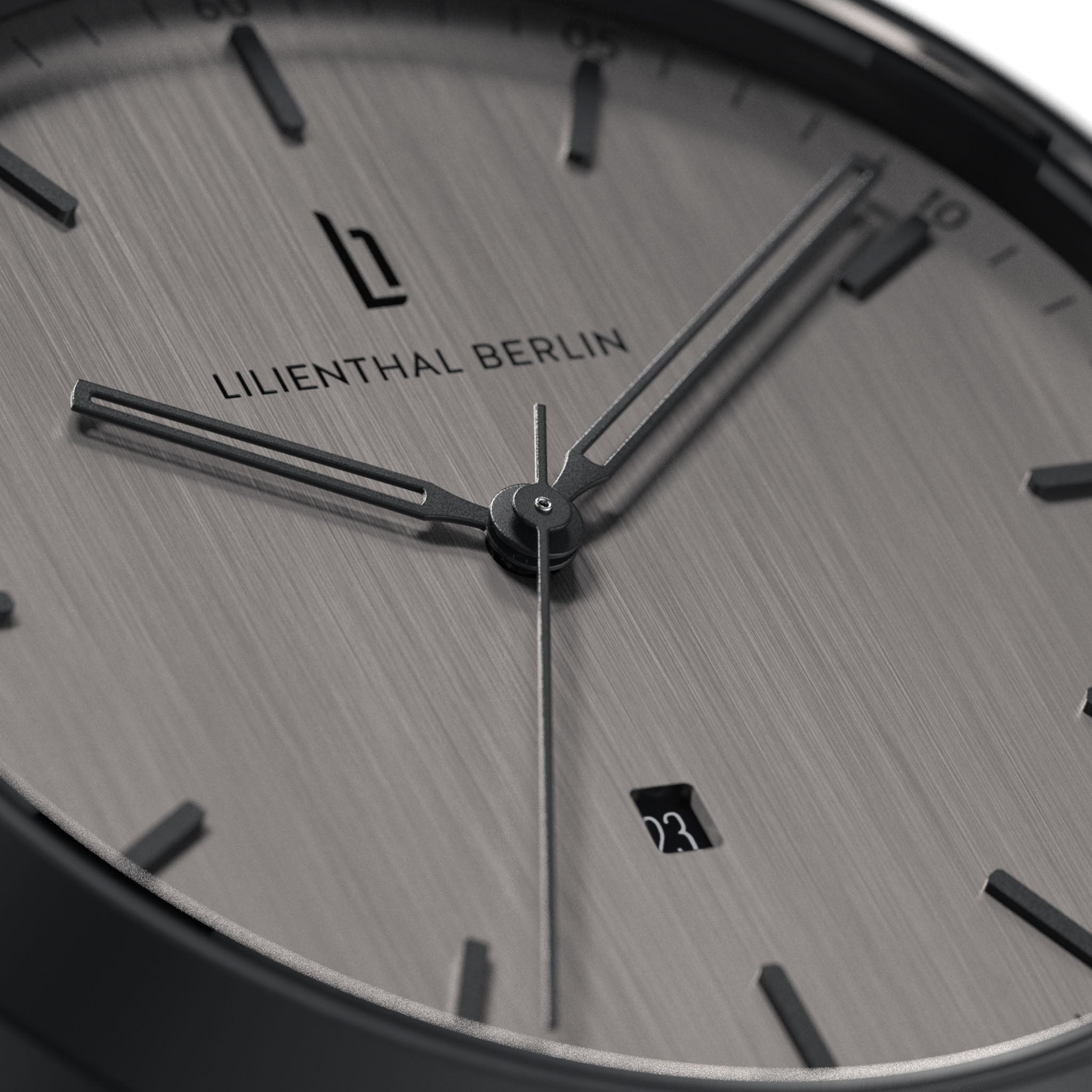Close-up of minimalist silver watch face with date display and sleek black hour markers
