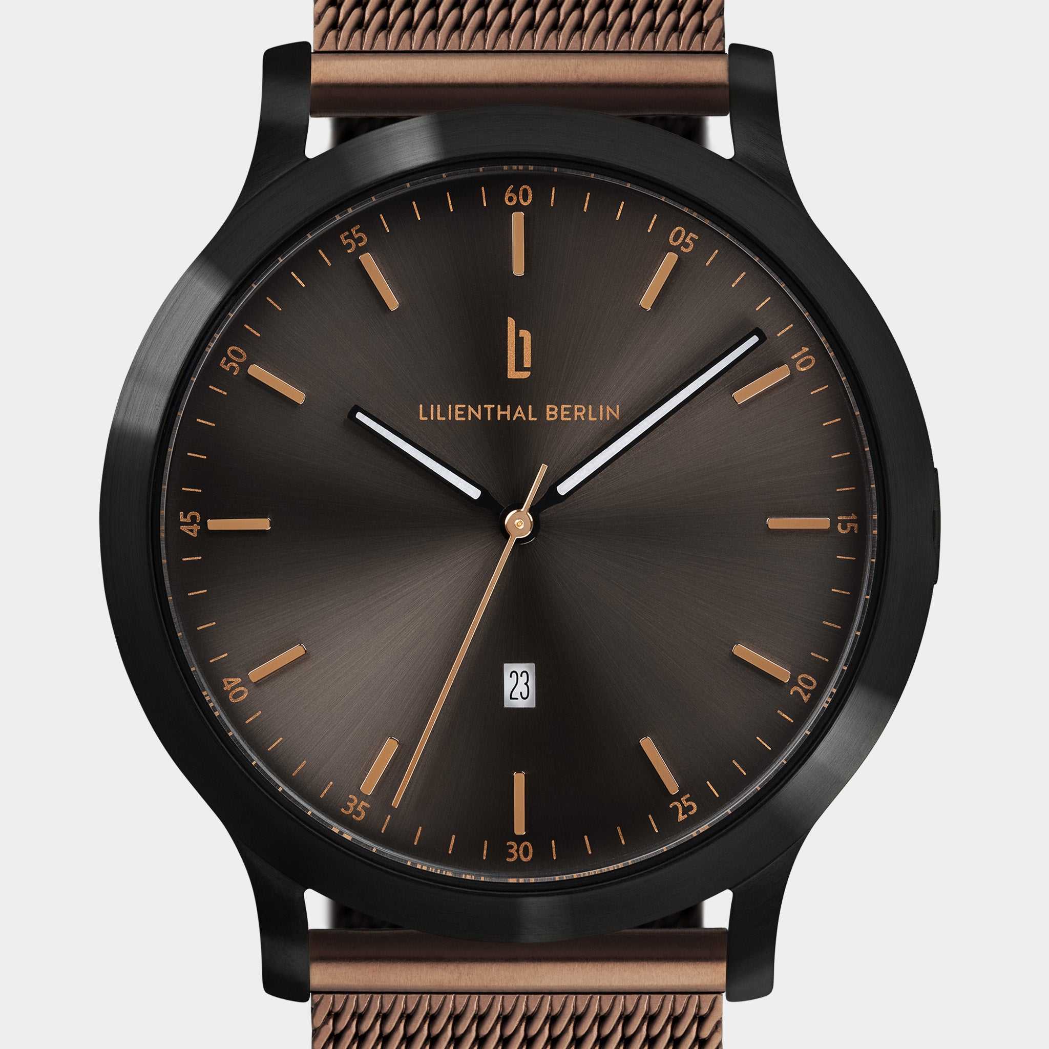 Elegant black and bronze mesh strap wristwatch with minimalist dial and date display