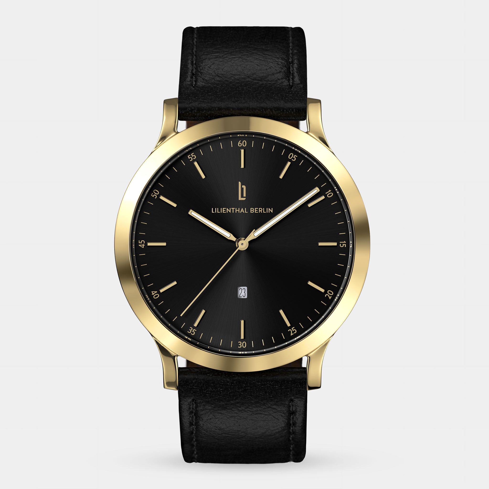 Gold and black minimalist wristwatch with black leather strap and date display