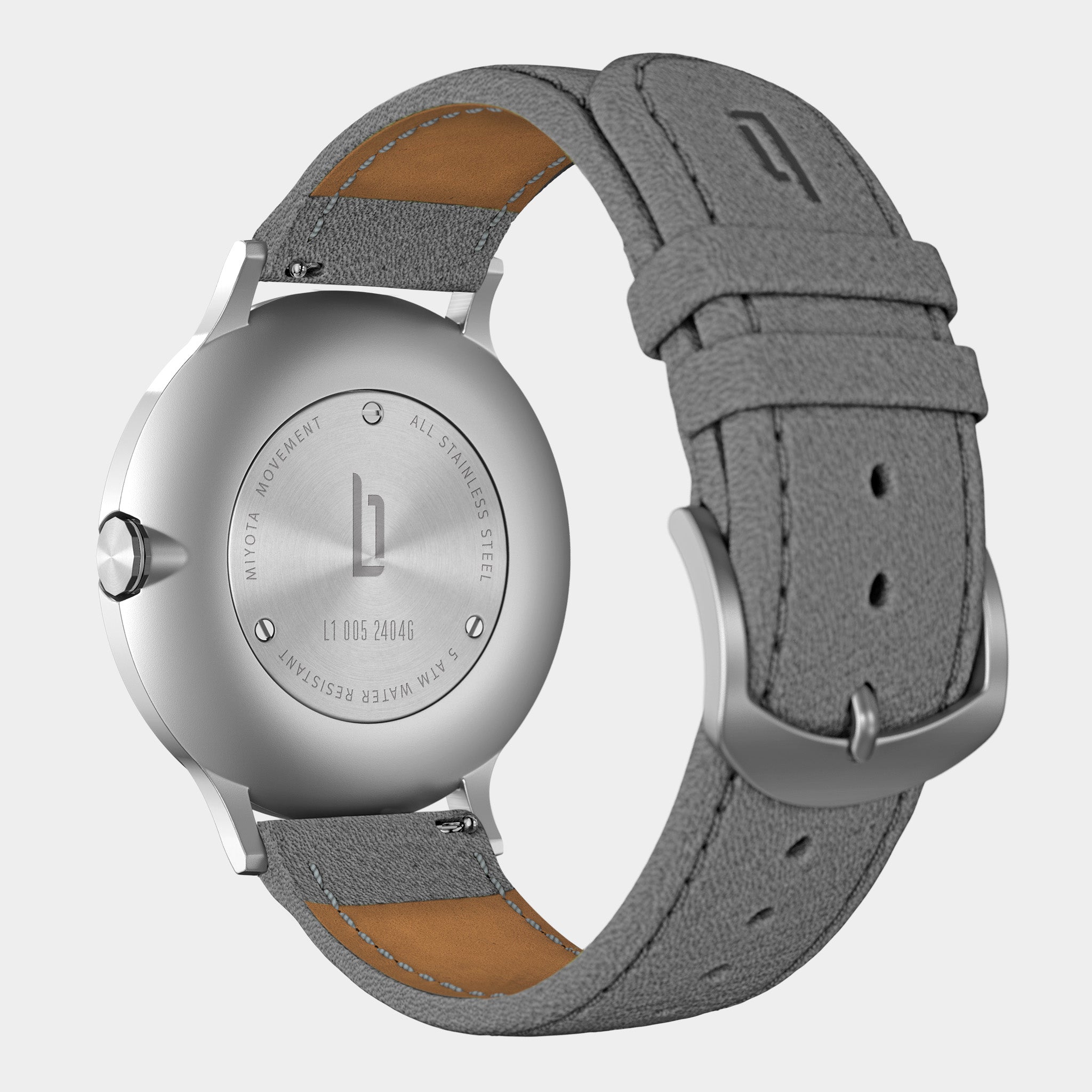 Stainless steel watch case with grey leather strap, visible case back and engraved details