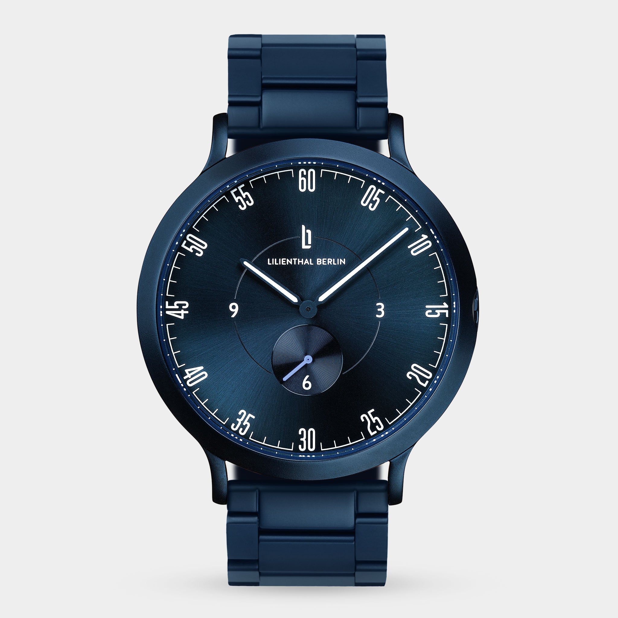 Sleek dark blue wristwatch with metal strap, minimalist dial, and small seconds subdial.