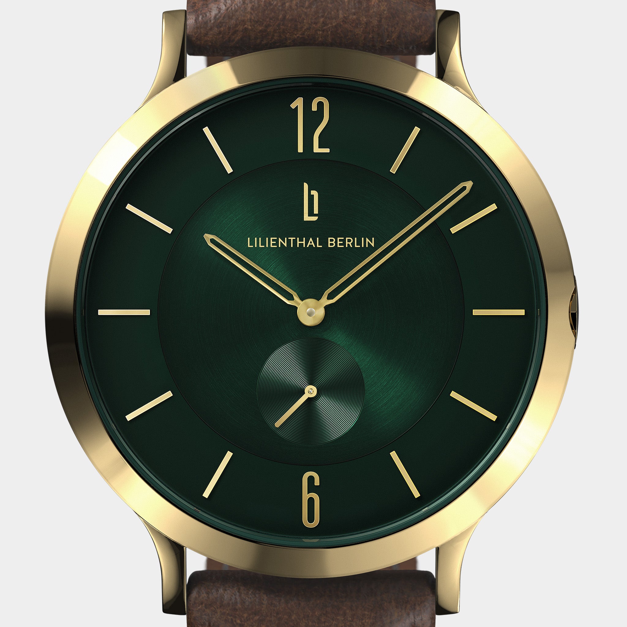 Gold case analog wristwatch with green dial, gold markers, and brown leather strap