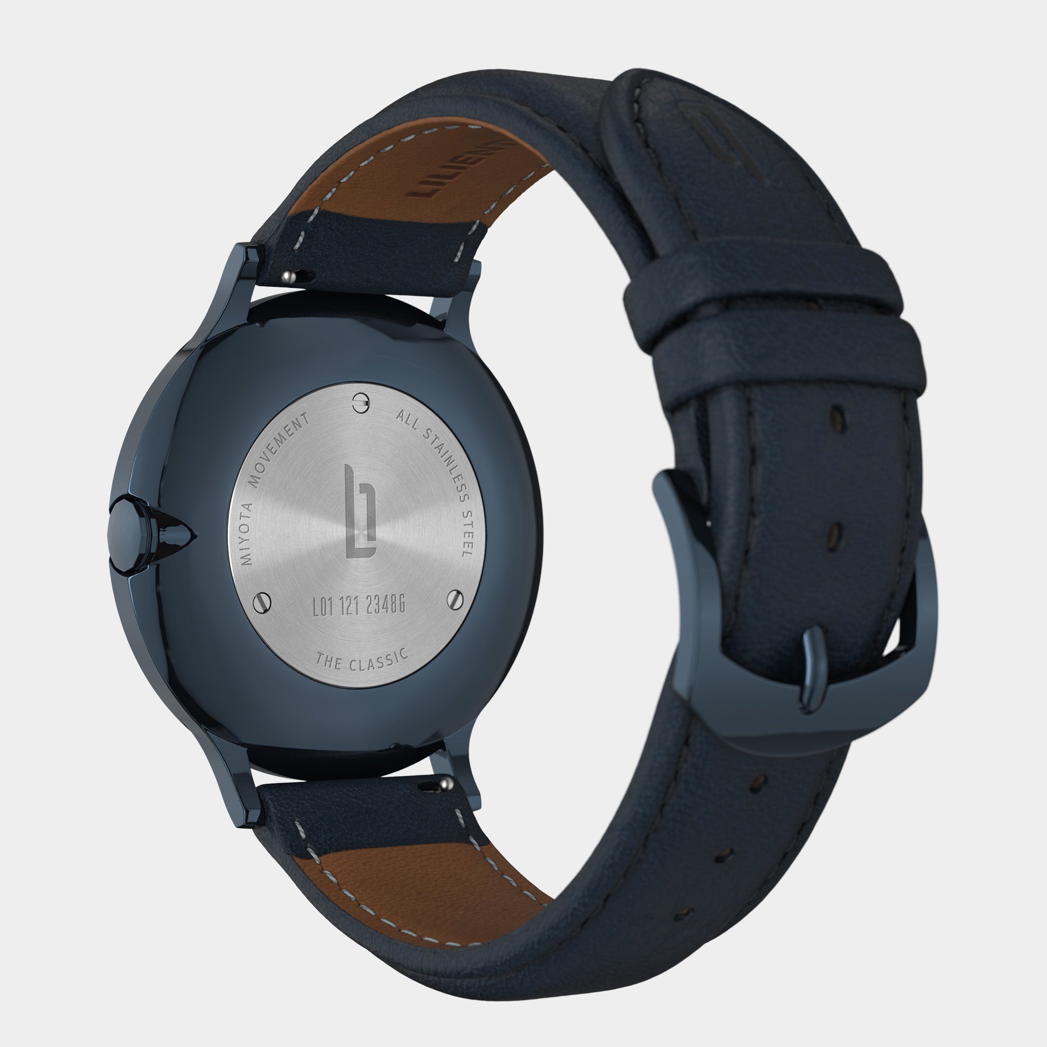 Close-up of a watch back with stainless steel case and navy leather strap