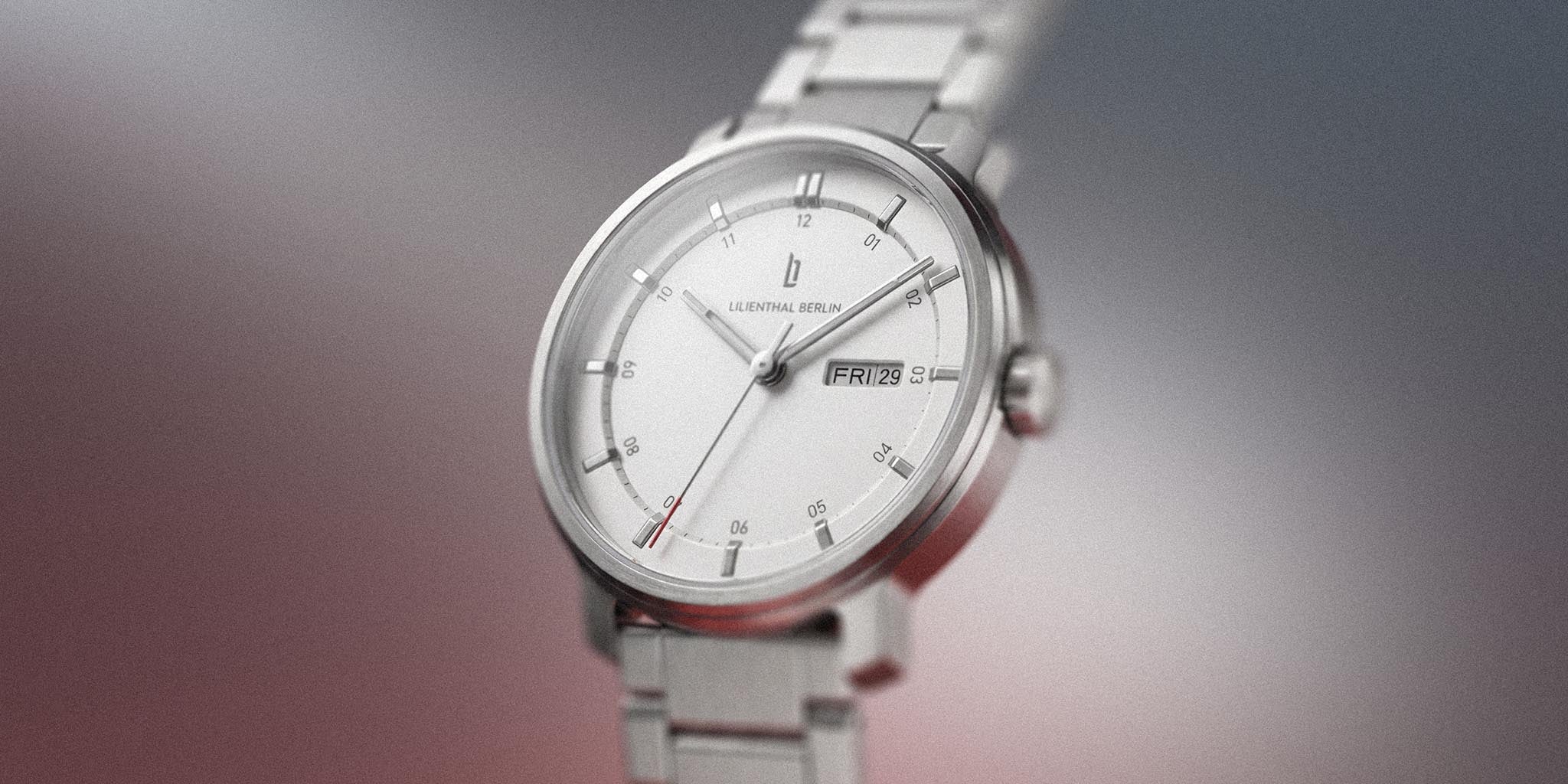 Silver stainless steel day-date watch with minimalist white dial and link bracelet