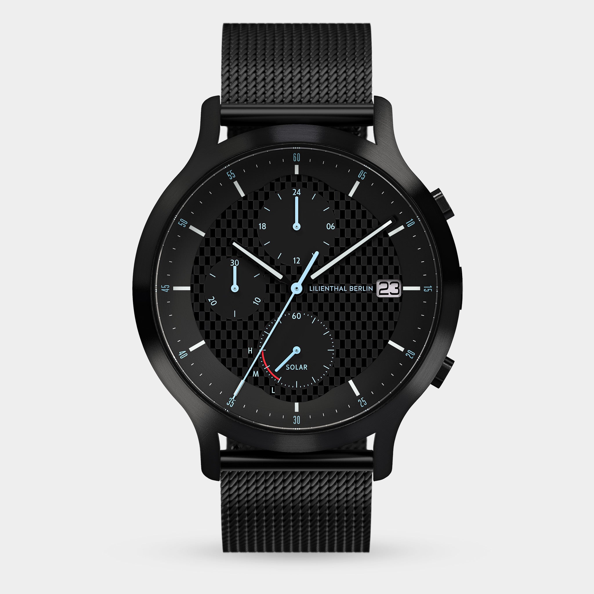 Black solar-powered chronograph watch with mesh strap, checkerboard dial, date display