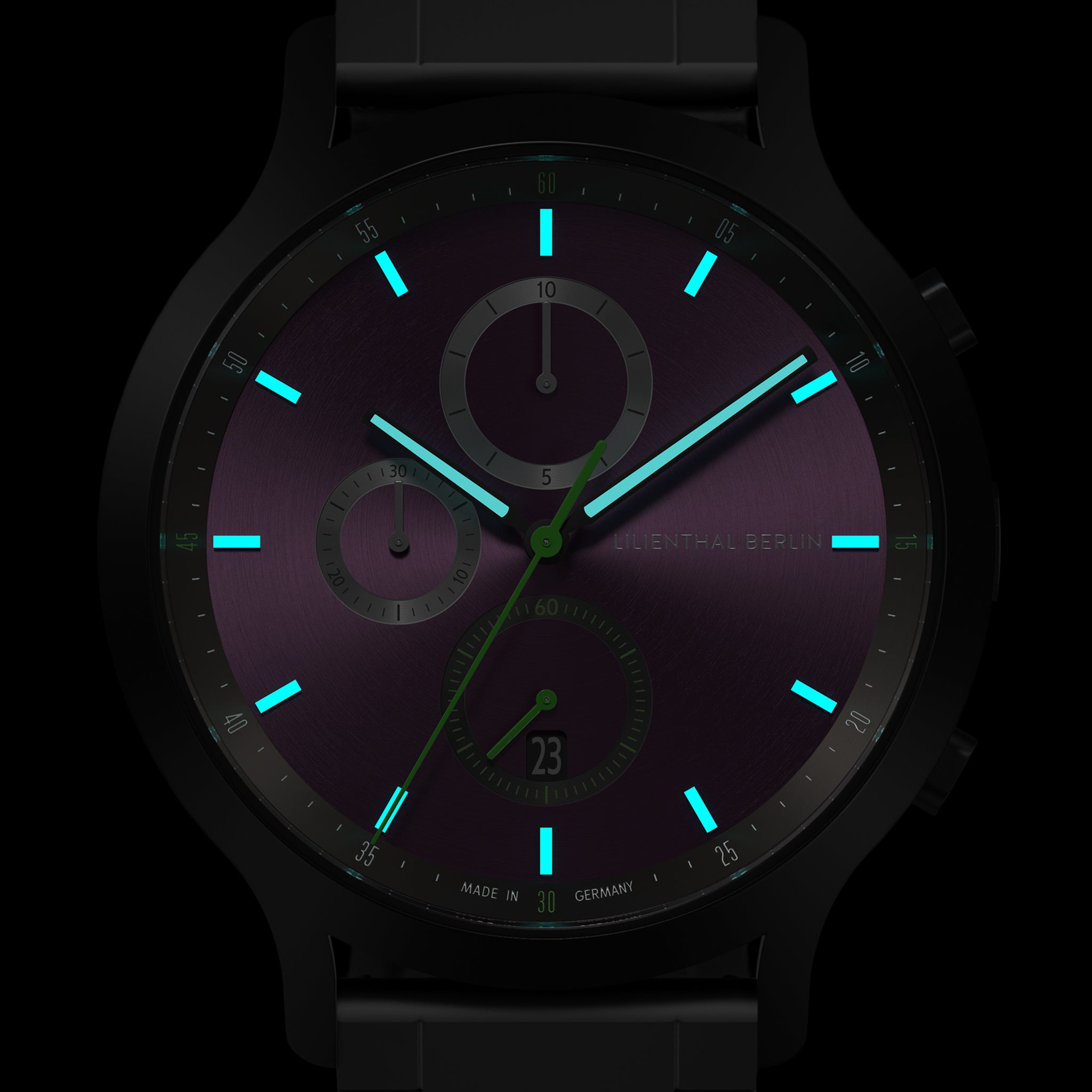 Chronograph watch with luminous blue hands and markers on a dark purple dial
