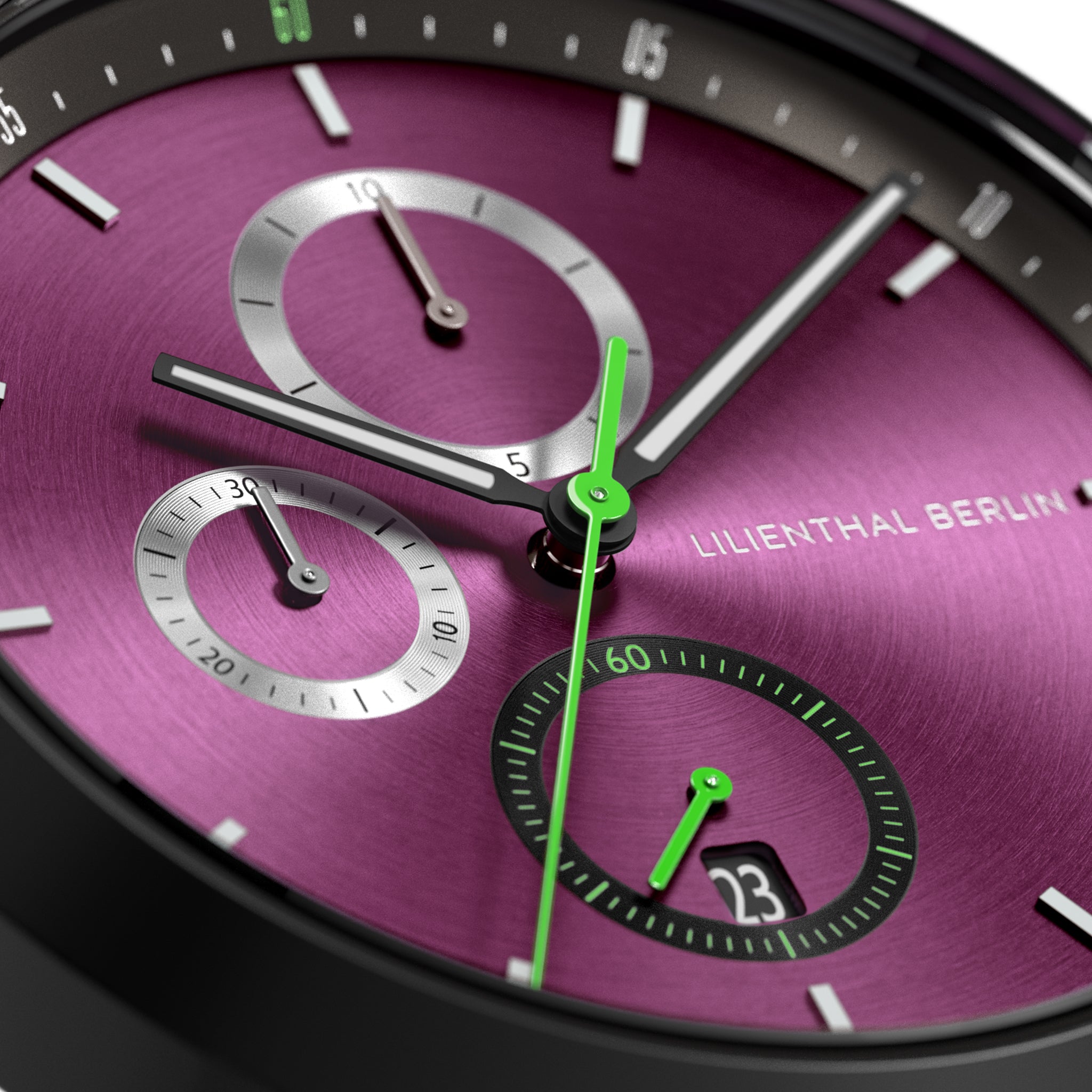 Close-up of a modern chronograph watch with a metallic purple dial, green accents, and subdials.