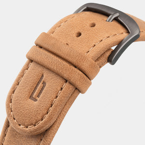 Tan leather watch strap with brushed metal buckle and stitched detailing