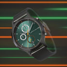 Modern green dial chronograph watch with black mesh strap against neon stripe background
