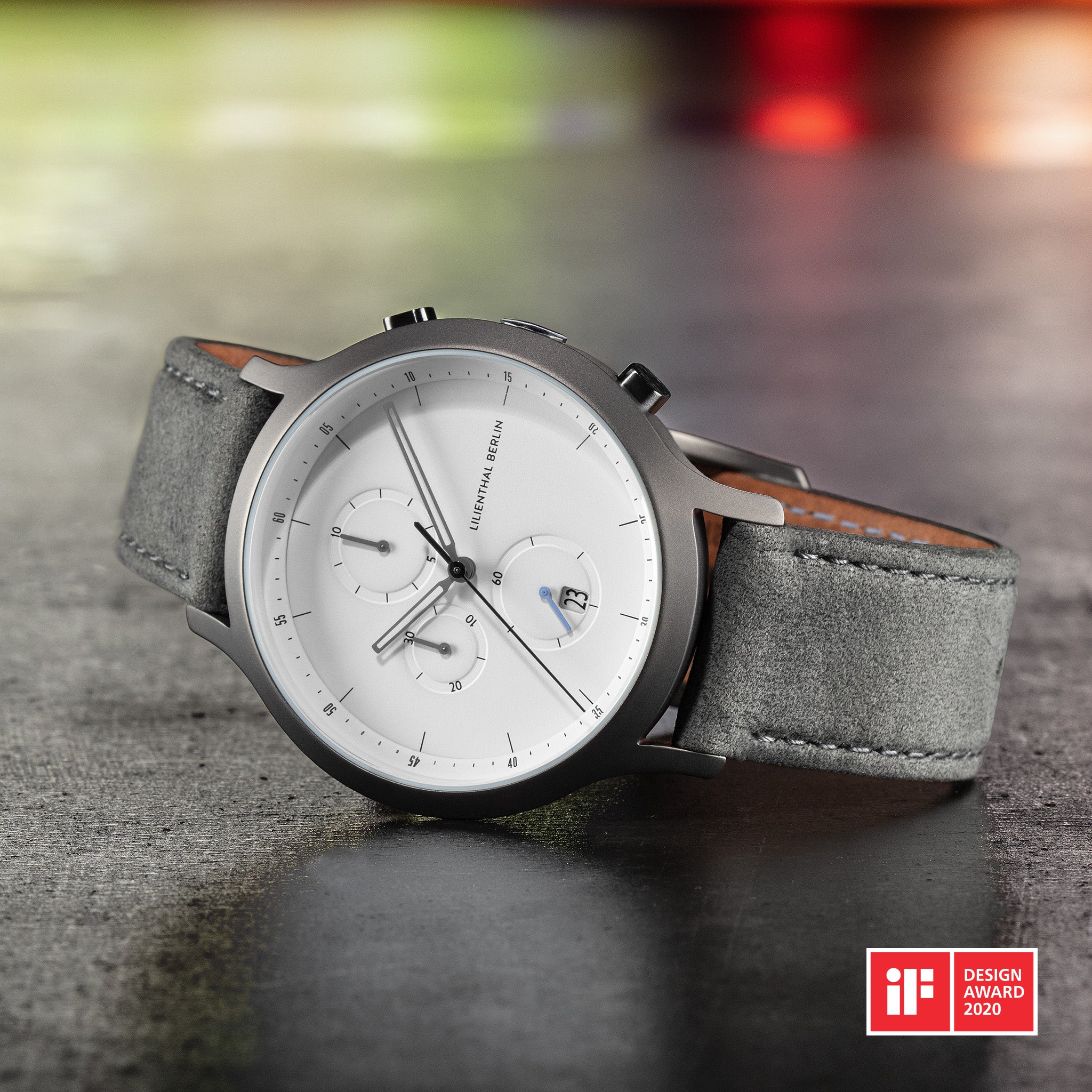 Minimalist silver chronograph watch with suede grey strap and date display, iF Design Award 2020