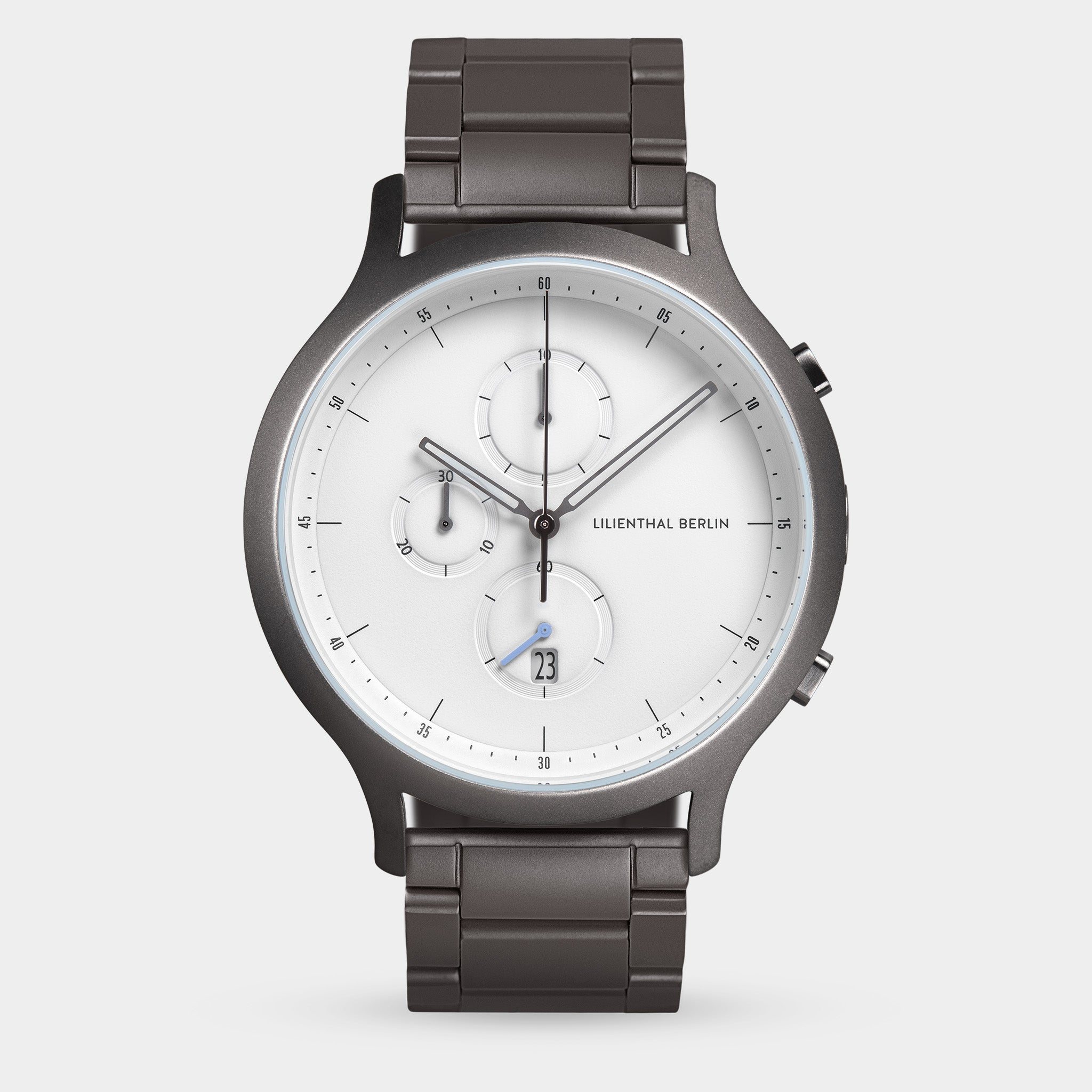Modern men's chronograph watch with white dial, subdials, and dark metal link bracelet