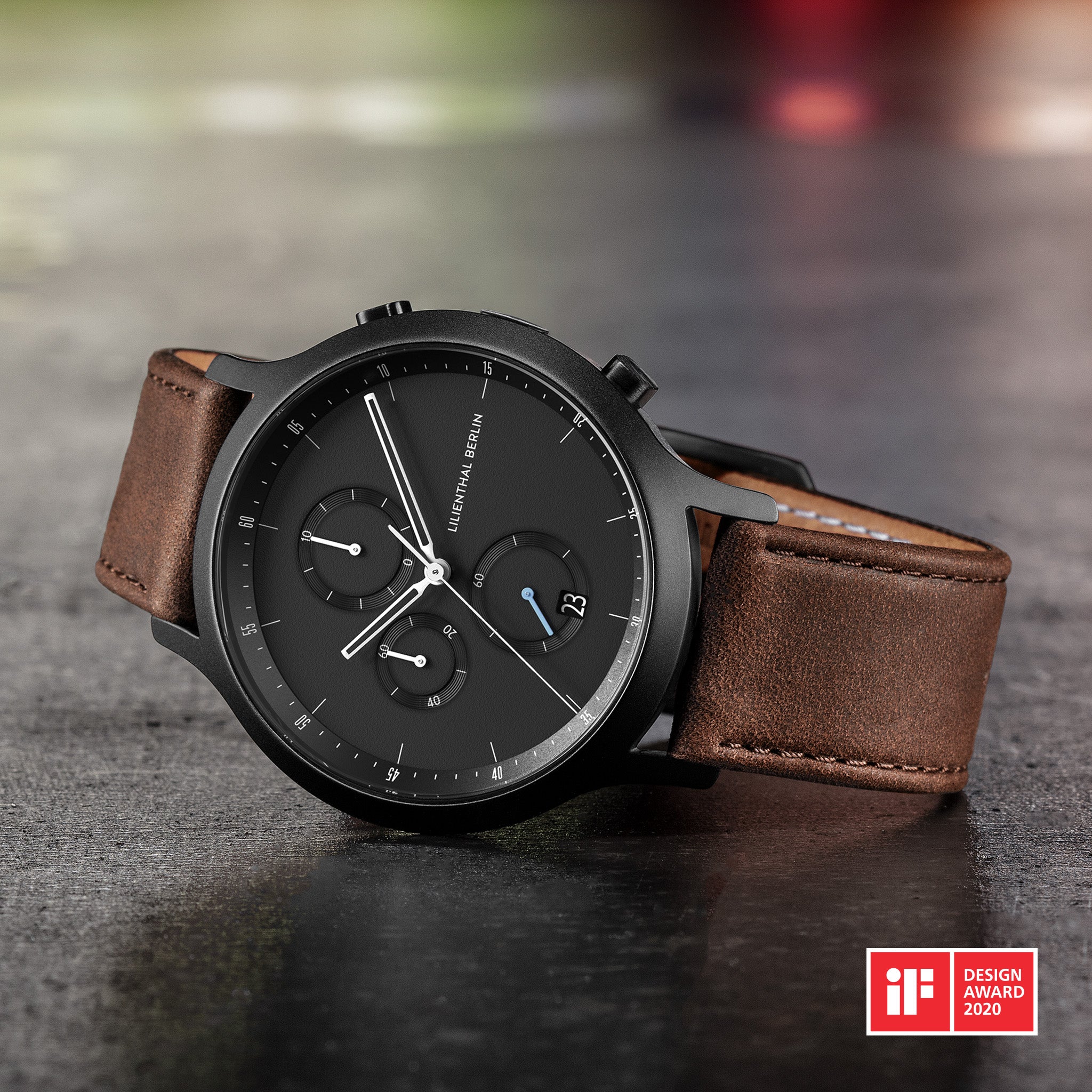 Men’s black chronograph watch with brown leather strap on stone surface, iF Design Award 2020