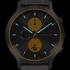 Black and gold chronograph wristwatch with luminous hands and date display