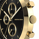 Luxury gold chronograph watch with black dial and subdials, close-up side view