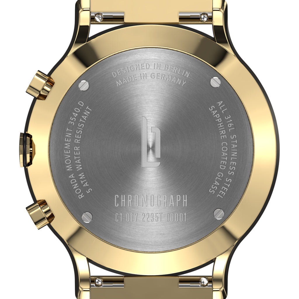 Gold and silver chronograph watch back with engraved details, stainless steel case