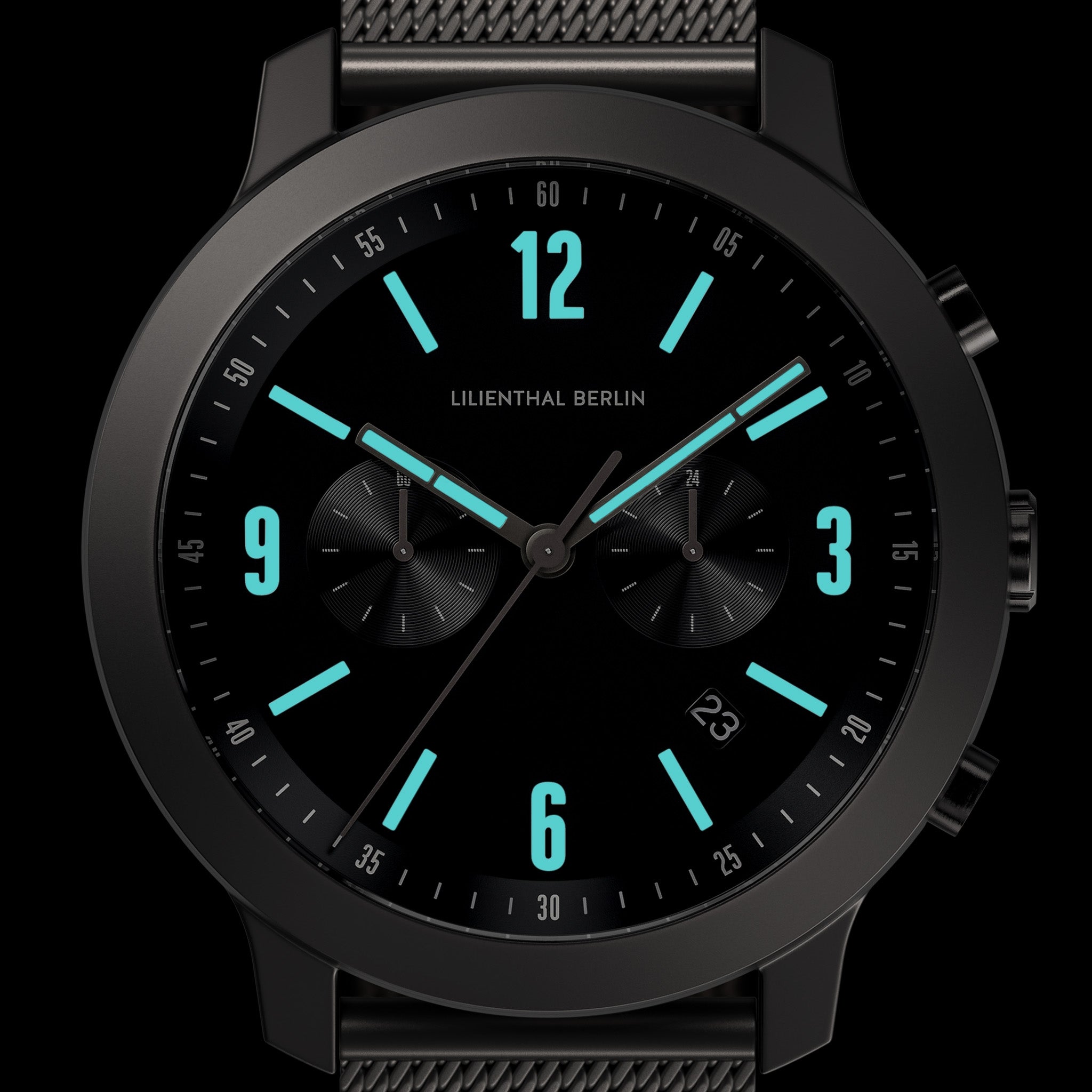 Modern black chronograph watch with turquoise dial accents and a mesh strap