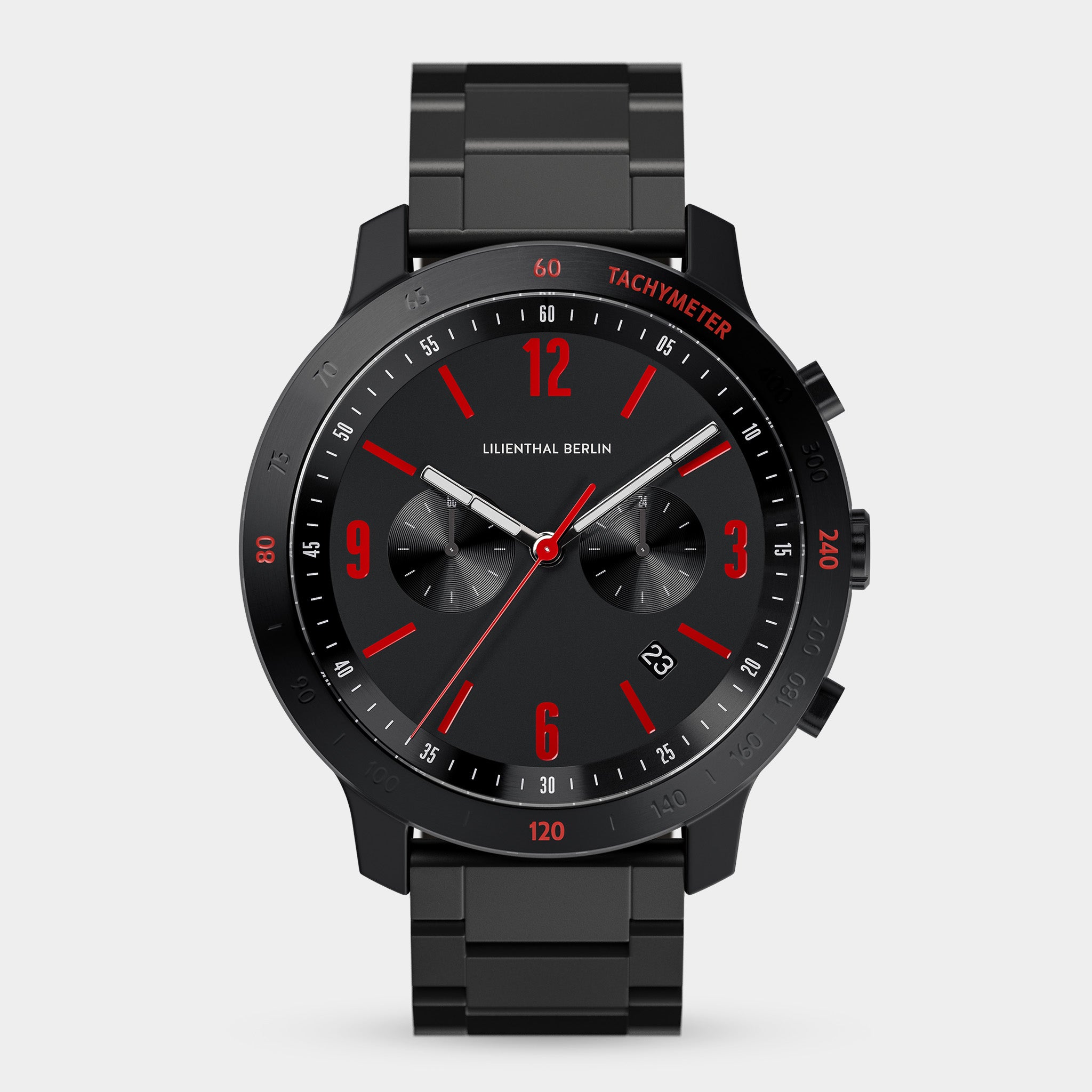 Black chronograph watch with red accents, metal bracelet, two subdials, and date display