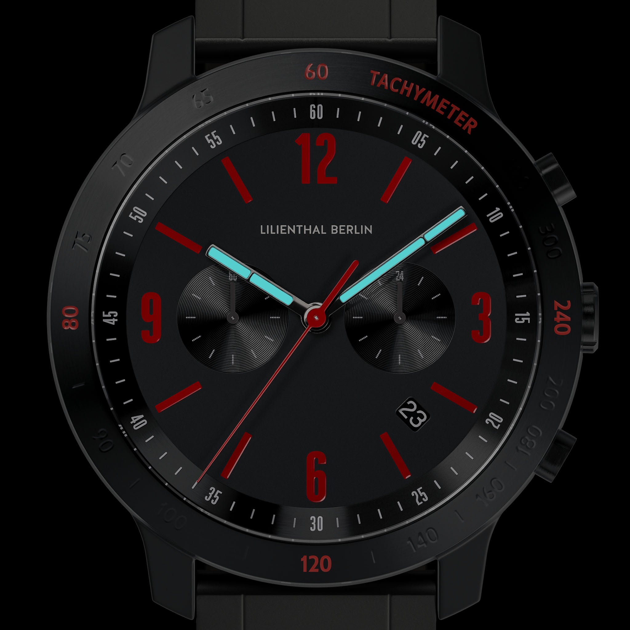 Black chronograph watch with red accents, luminous hands, and tachymeter scale