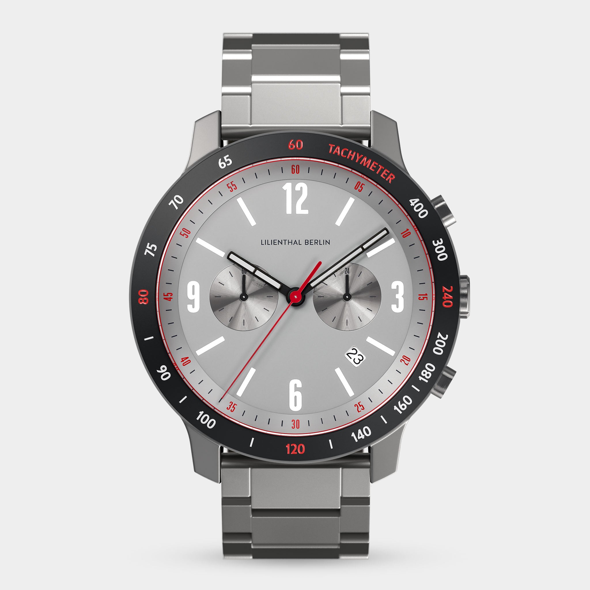 Stainless steel chronograph watch with grey dial, red tachymeter bezel, and date display.