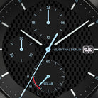 Close-up of chronograph solar watch dial with subdials, date display, and textured background