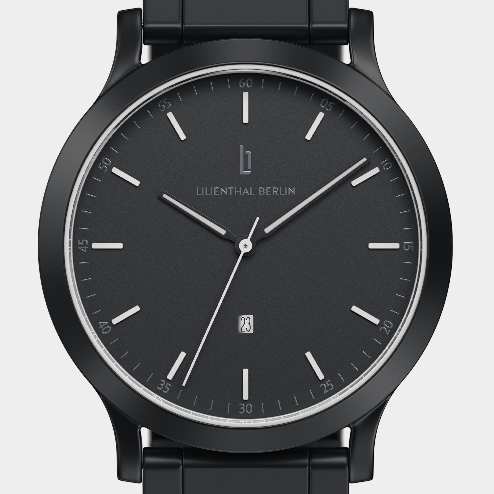 Minimalist black watch with black dial, silver hands, date display, and metal band