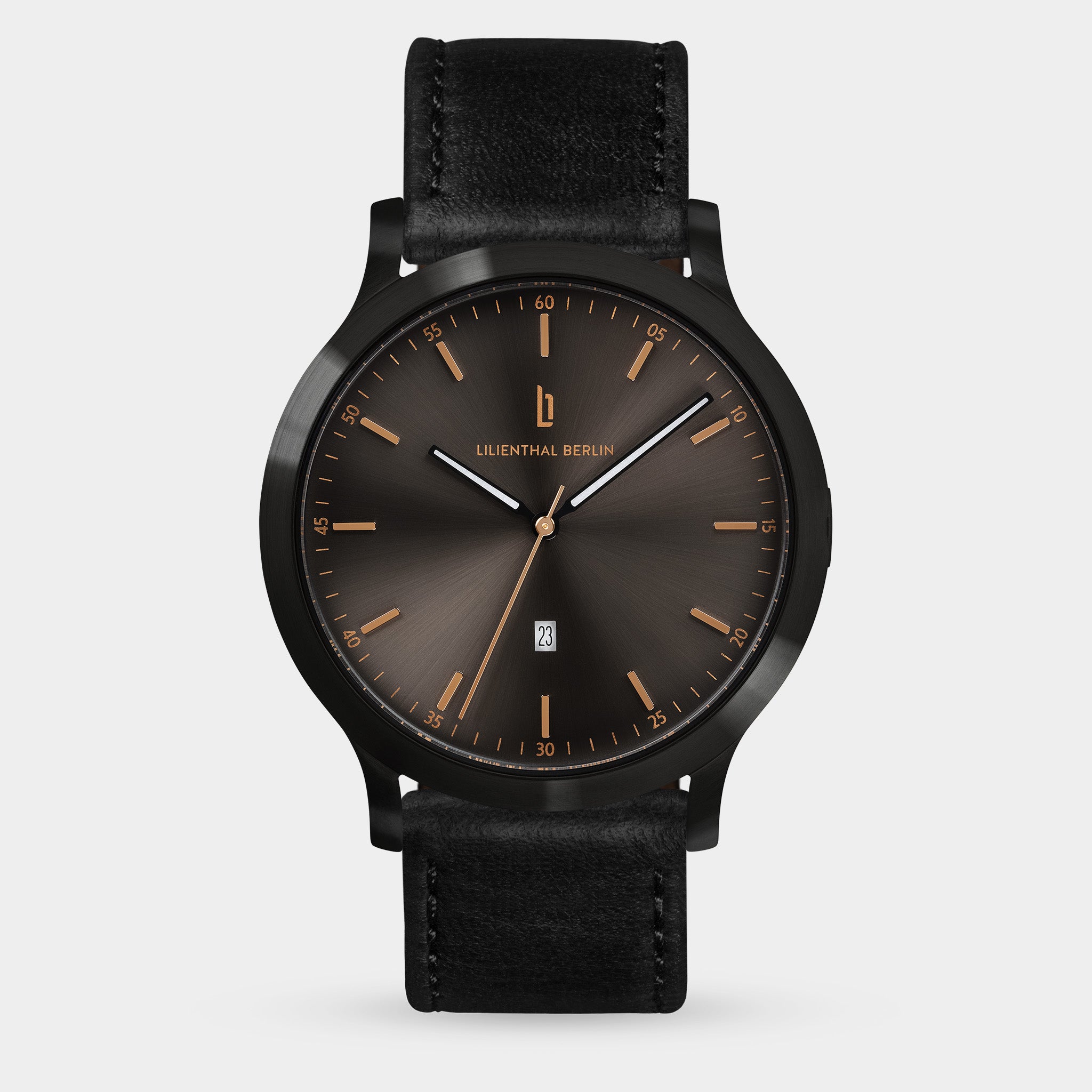 Men's black leather strap watch with dark sunburst dial, gold-tone markers, and date window