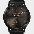 Elegant black watch with sunburst dial, gold hour markers, date display, and black leather strap