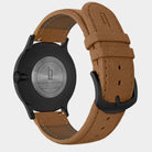 Black stainless steel watch case with brown leather strap and engraved back, minimalist design