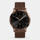 Elegant wristwatch with black dial, gold hour markers, date display, and brown leather strap