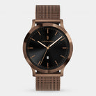 Minimalist bronze mesh strap watch with black dial and gold markers on white background