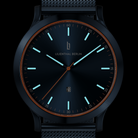 Modern black wristwatch with blue luminous markers, mesh strap, and minimalist dial design