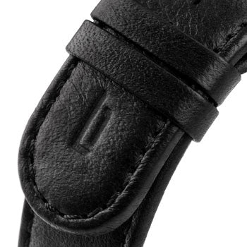 Close-up of a black leather watch strap with stitched detailing and loops