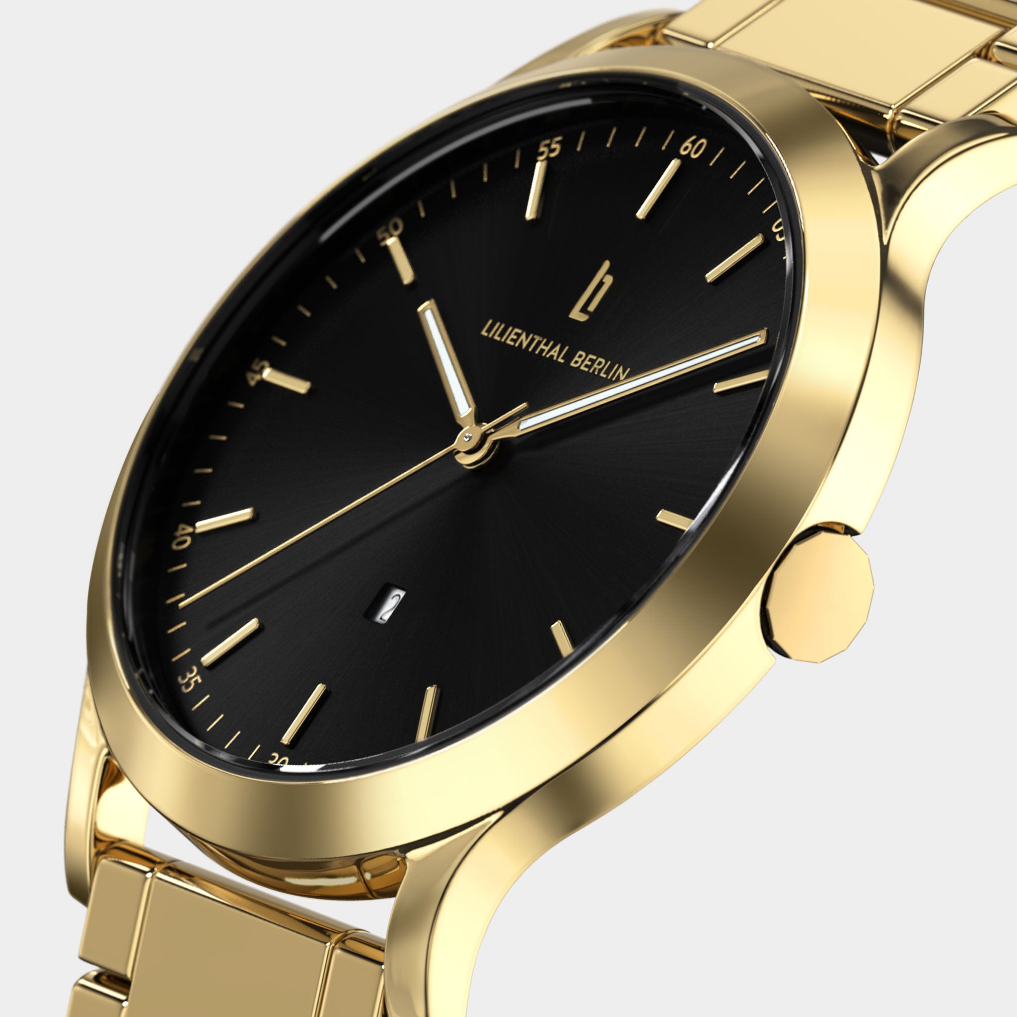 Elegant gold wristwatch with black dial, minimalist markers, and date display