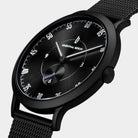 Sleek black wristwatch with mesh strap, minimalist dial and white numerals on display