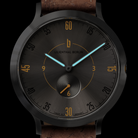 Black minimalist wristwatch with brown leather strap, sunburst dial, blue hands, and gold accents